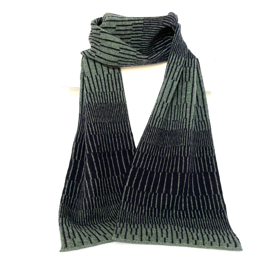 Peacock Green and Navy Blue handcrafted merino Lambswool striped Reverb Scarf hanging on a white display stand  against a neutral background. Pom Shanty Knitwear.