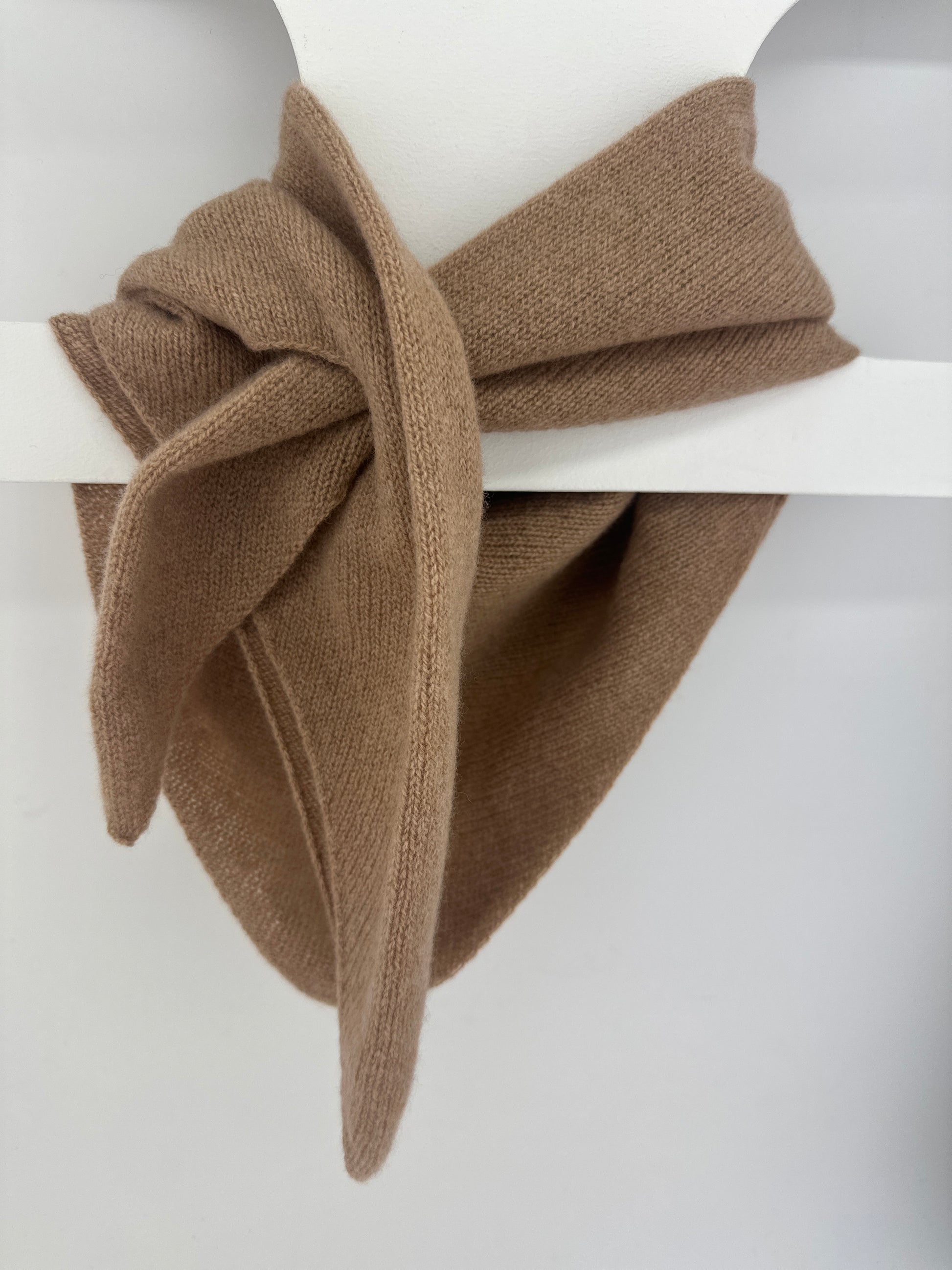 merino lambswool double layer solid colour, camel brown pull through triangle scarf / kerchief / neckerchief for women, men, unisex hanging from a white hanger on a neutral background