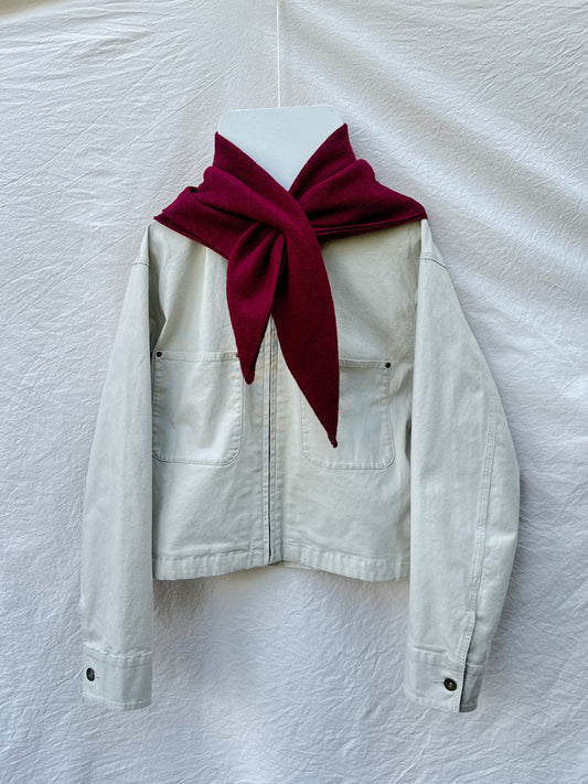 Burgundy Triangle Scarf, merino wool, draped over a cream jacket