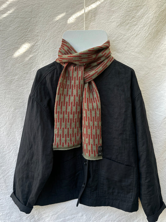 Olive and Sienna Brown Rain Skinny Scarf, lambswool, draped over a black jacket