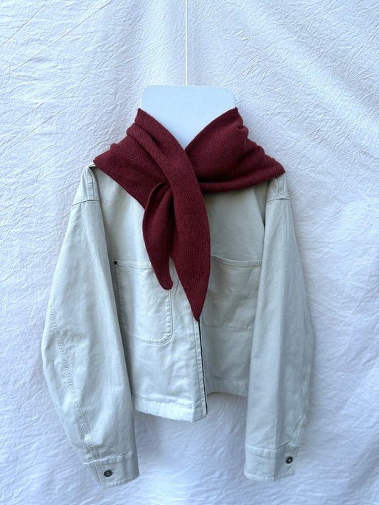 Sienna Brown Triangle Scarf, merino wool, draped over a cream jacket